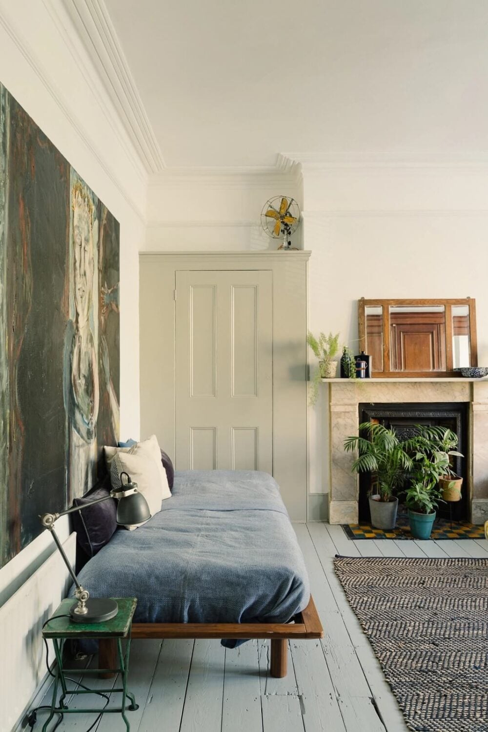 A Victorian House in London with Yellow Color Accents 13 bedroom-fireplace-large-rug-white-floorboards-nordroom