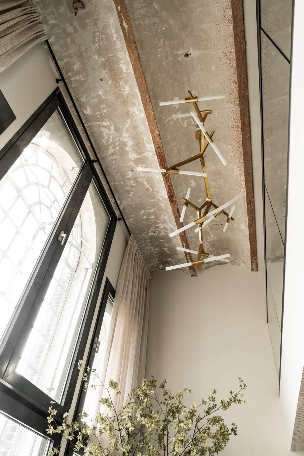 A Stylish Monochrome Penthouse in a Former Prison Building 17 concrete-vaulted-ceiling-penthouse-netherlands-nordroom