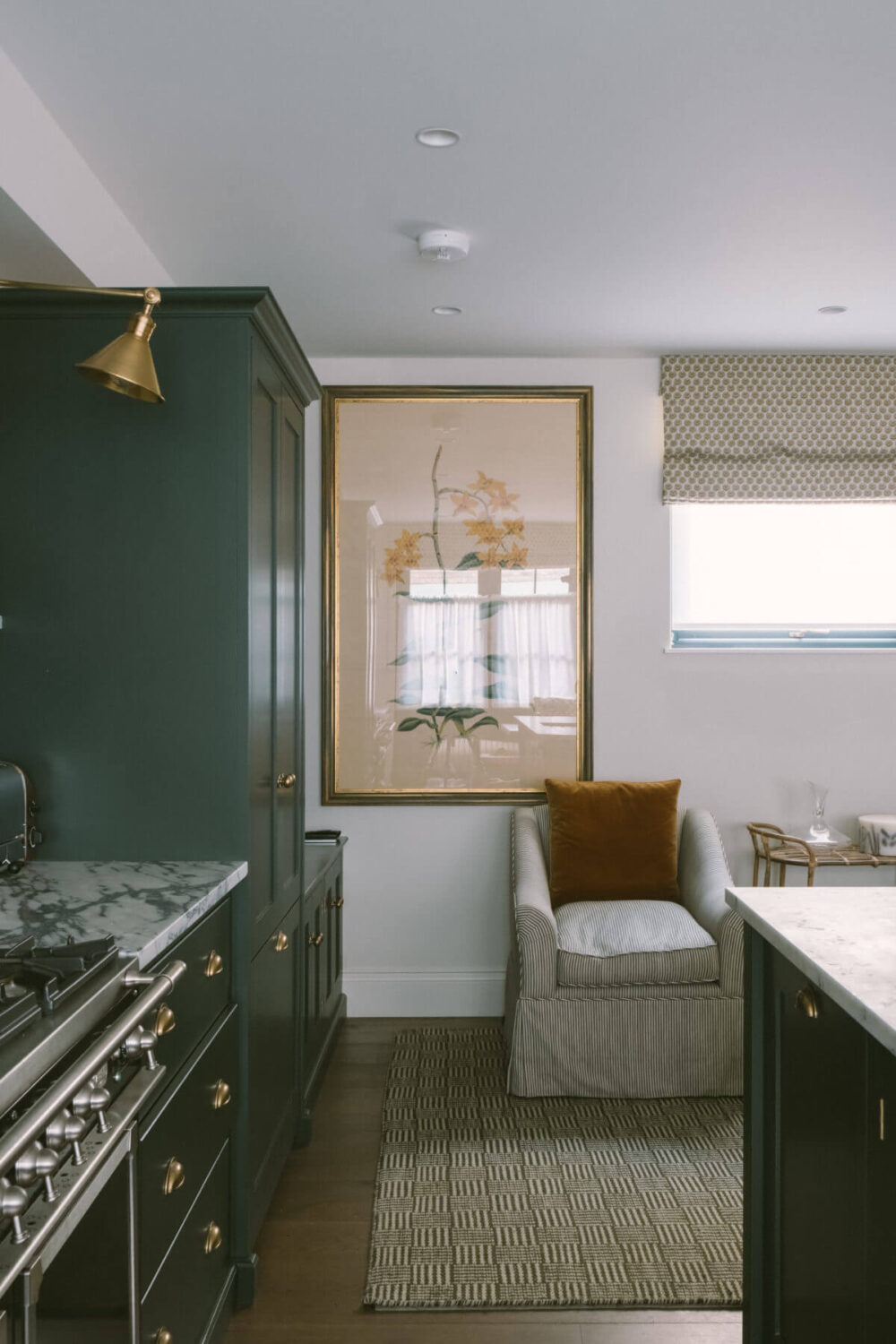 A London Mews House Made Famous in Love Actually 6 dark-green-devol-kitchen-sitting-area-mews-house-nordroom