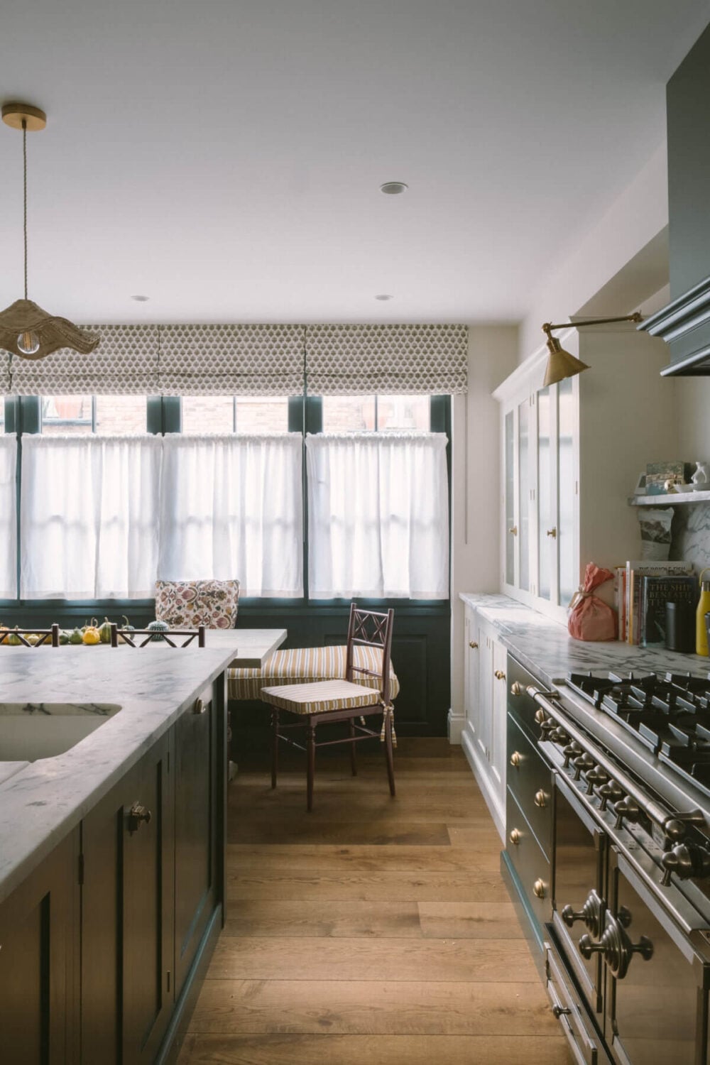 A London Mews House Made Famous in Love Actually 3 dark-green-devol-kitchen-wooden-floor-nordroom