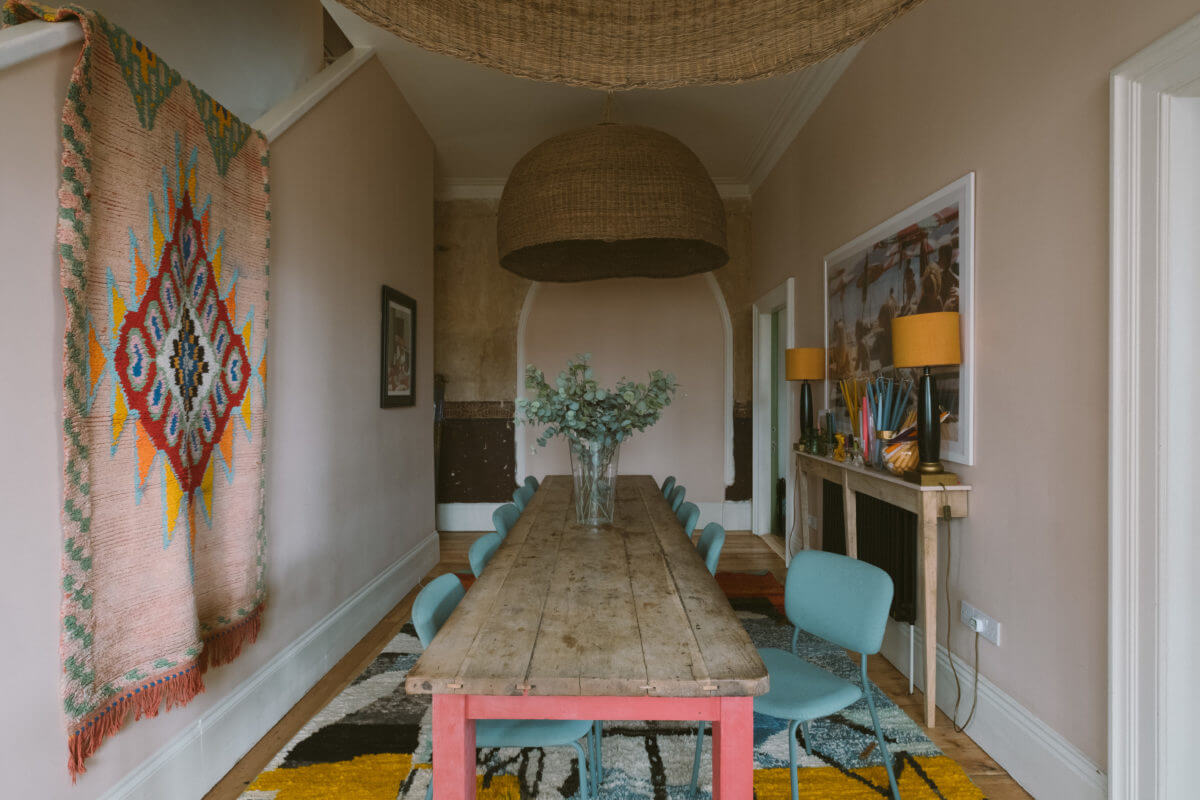 A Colorful Vintage Eclectic Home in England 18 dining-room-rustic-farmhouse-table-blue-dining-chairs-nordroom