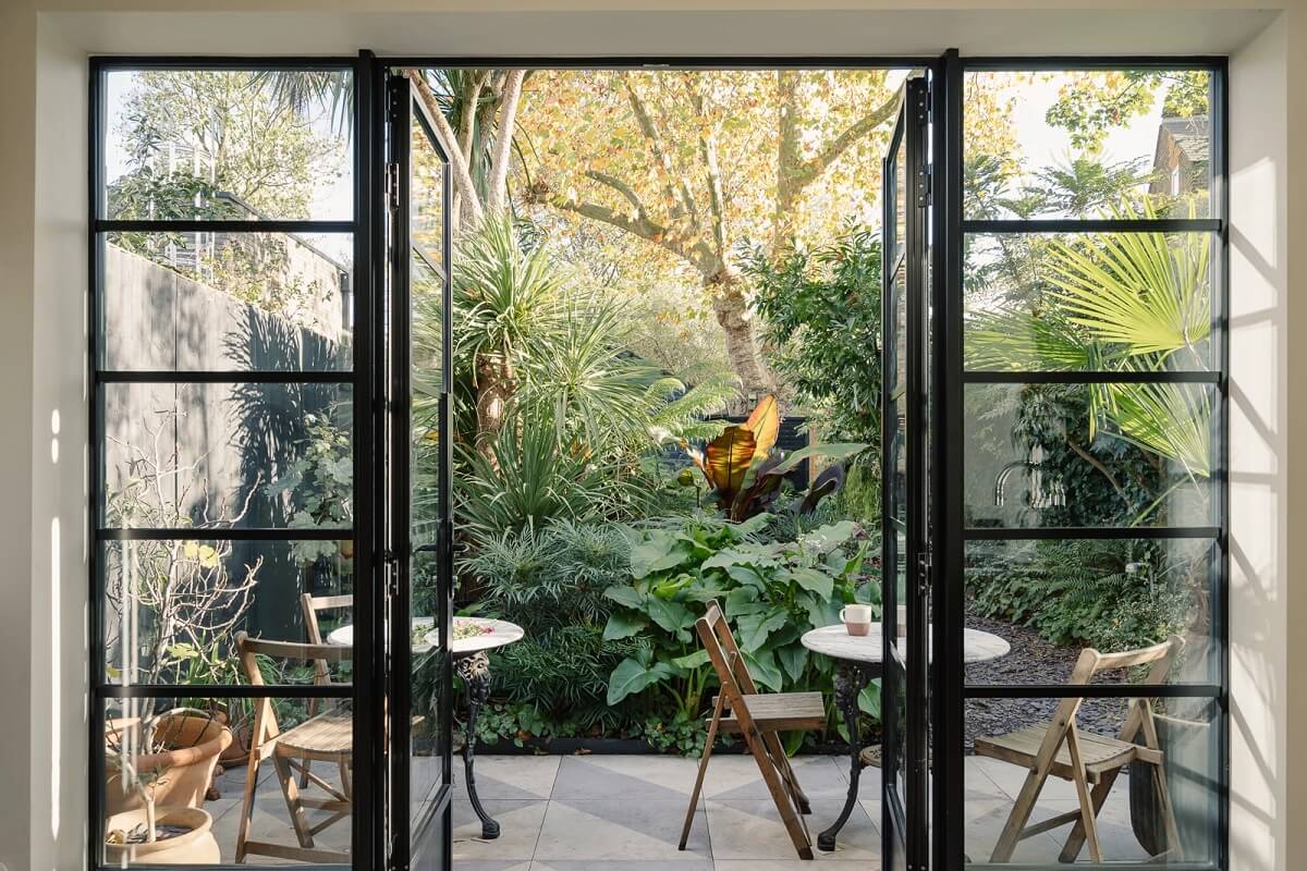 A Victorian House in London with Yellow Color Accents 6 double-doors-black-garden-modern-extension-nordroom