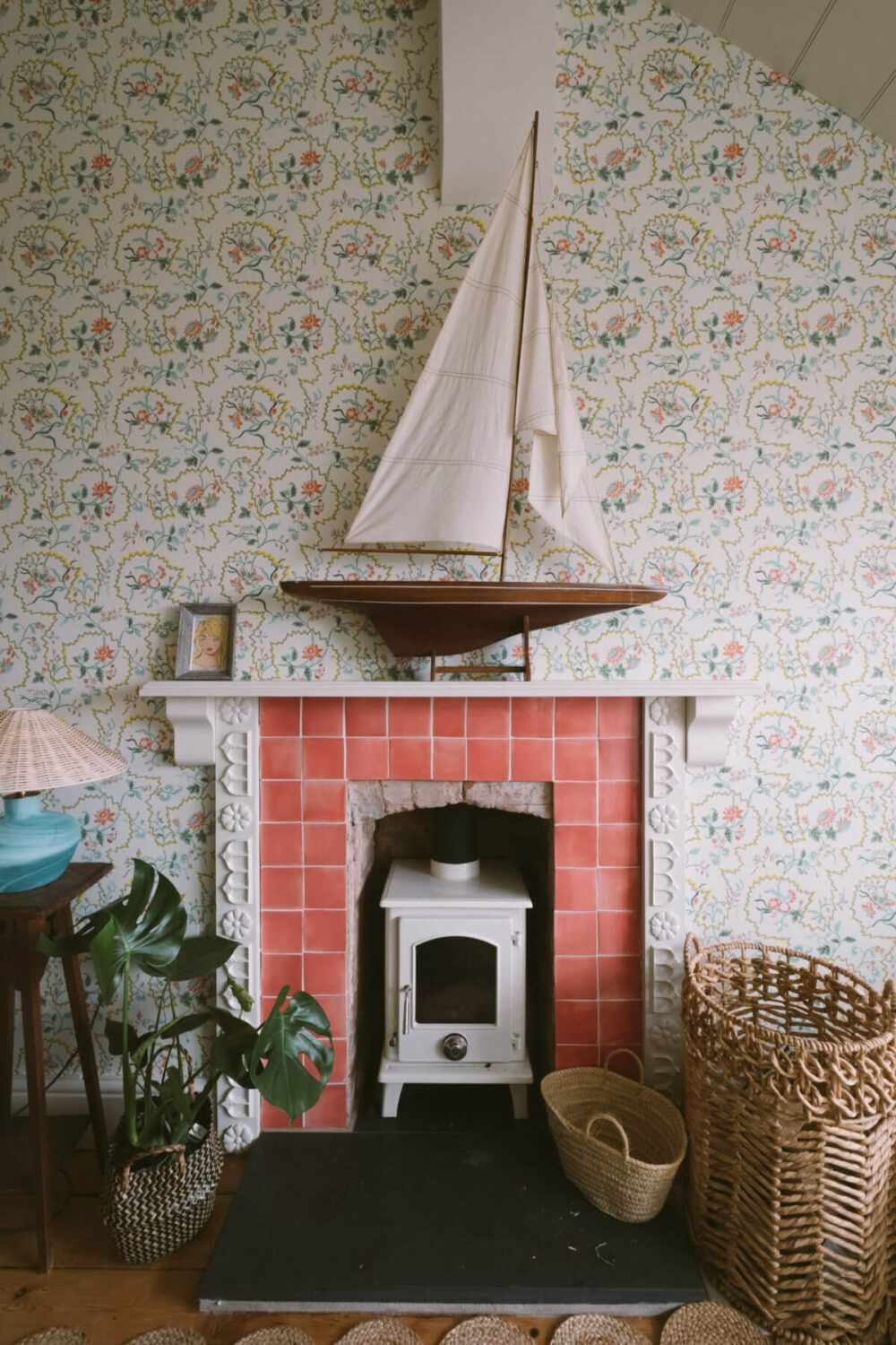 A Colorful Vintage Eclectic Home in England 25 fireplace-red-tiles-wallpaper-snug-nordroom