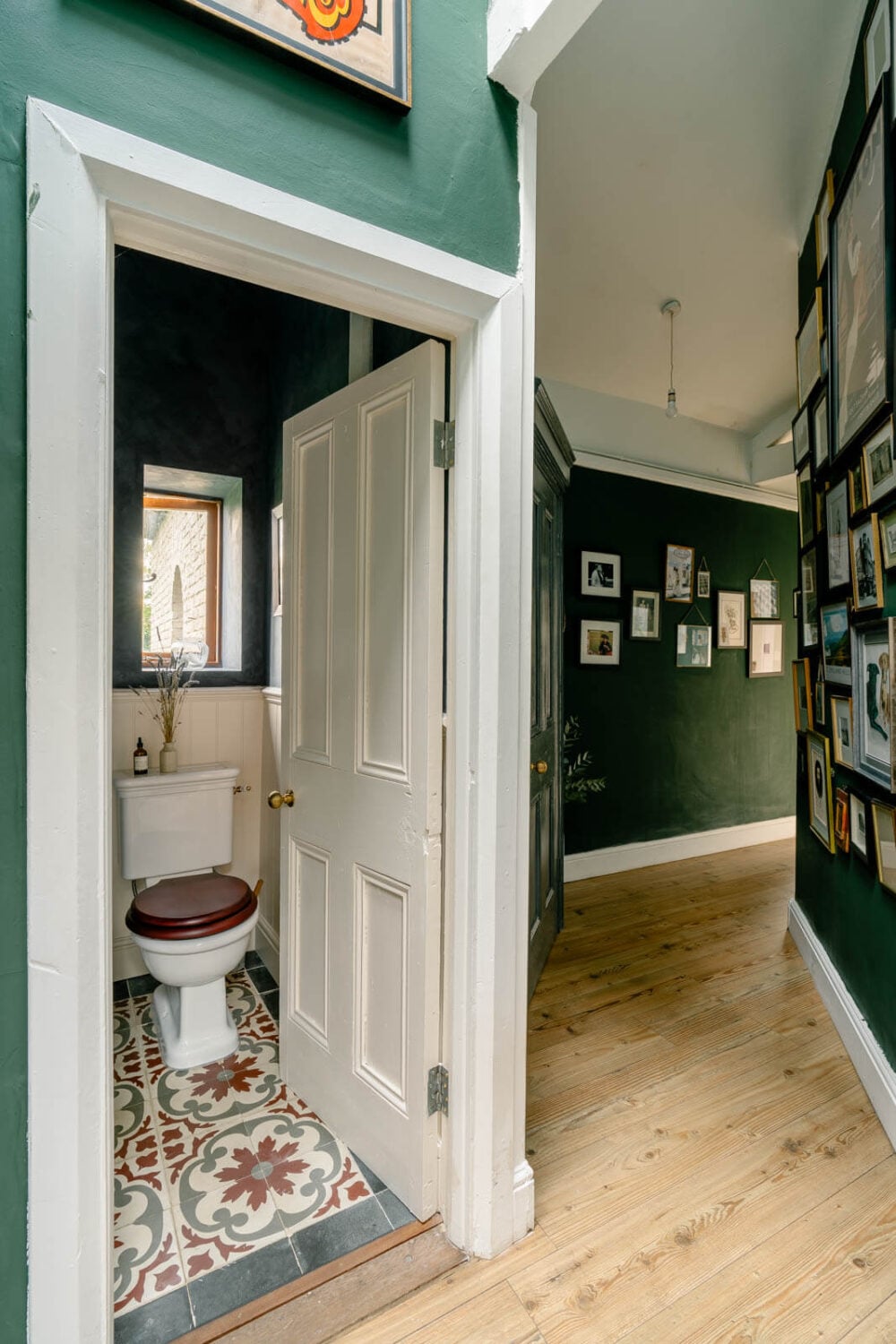 An English Barn Conversion Decorated in Green and Blue 9 hallway-green-walls-powder-room-floor-tiles-nordroom
