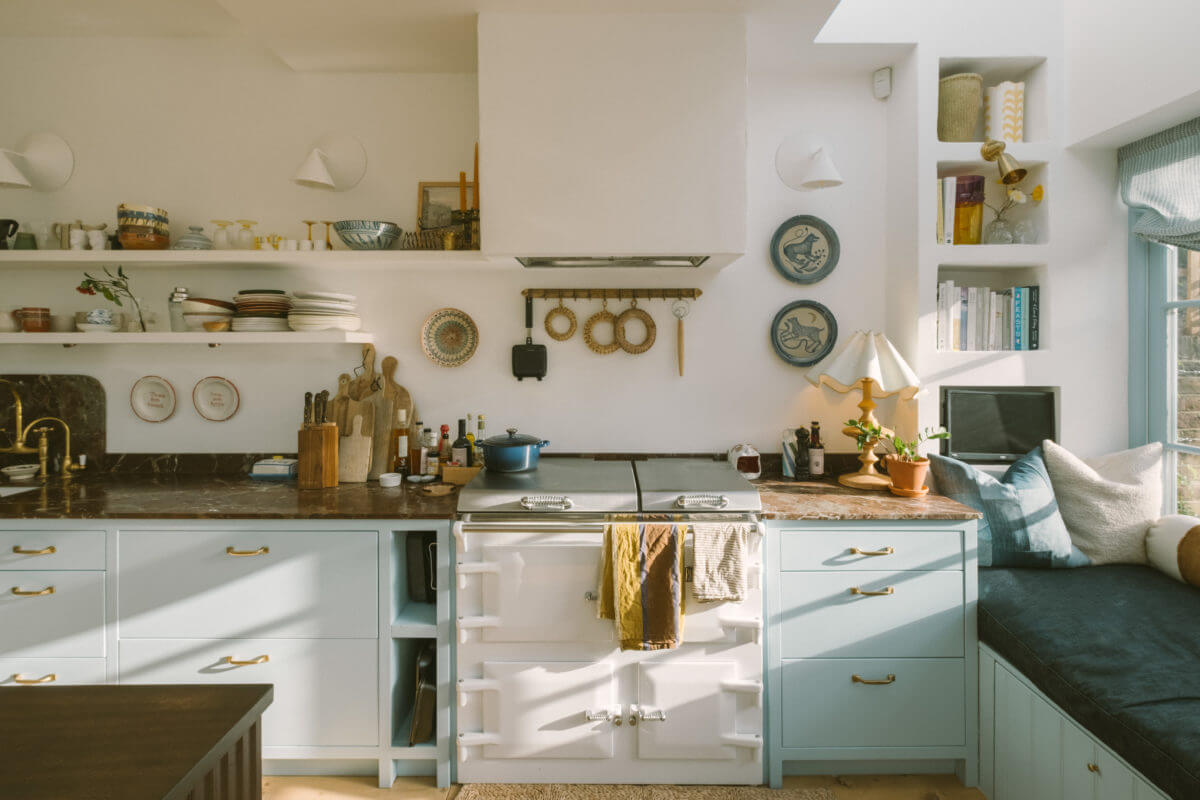 A Victorian House in London with a Blue Sitting Room 14 kitchen-light-blue-cabinets-aga-stove-window-seat-nordroom