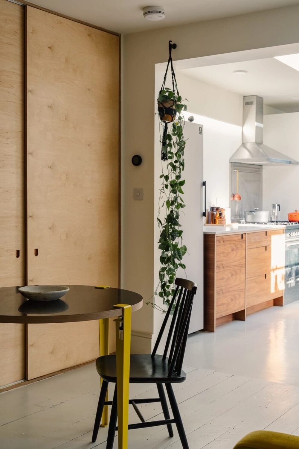 A Victorian House in London with Yellow Color Accents 3 kitchen-table-built-in-closet-nordroom