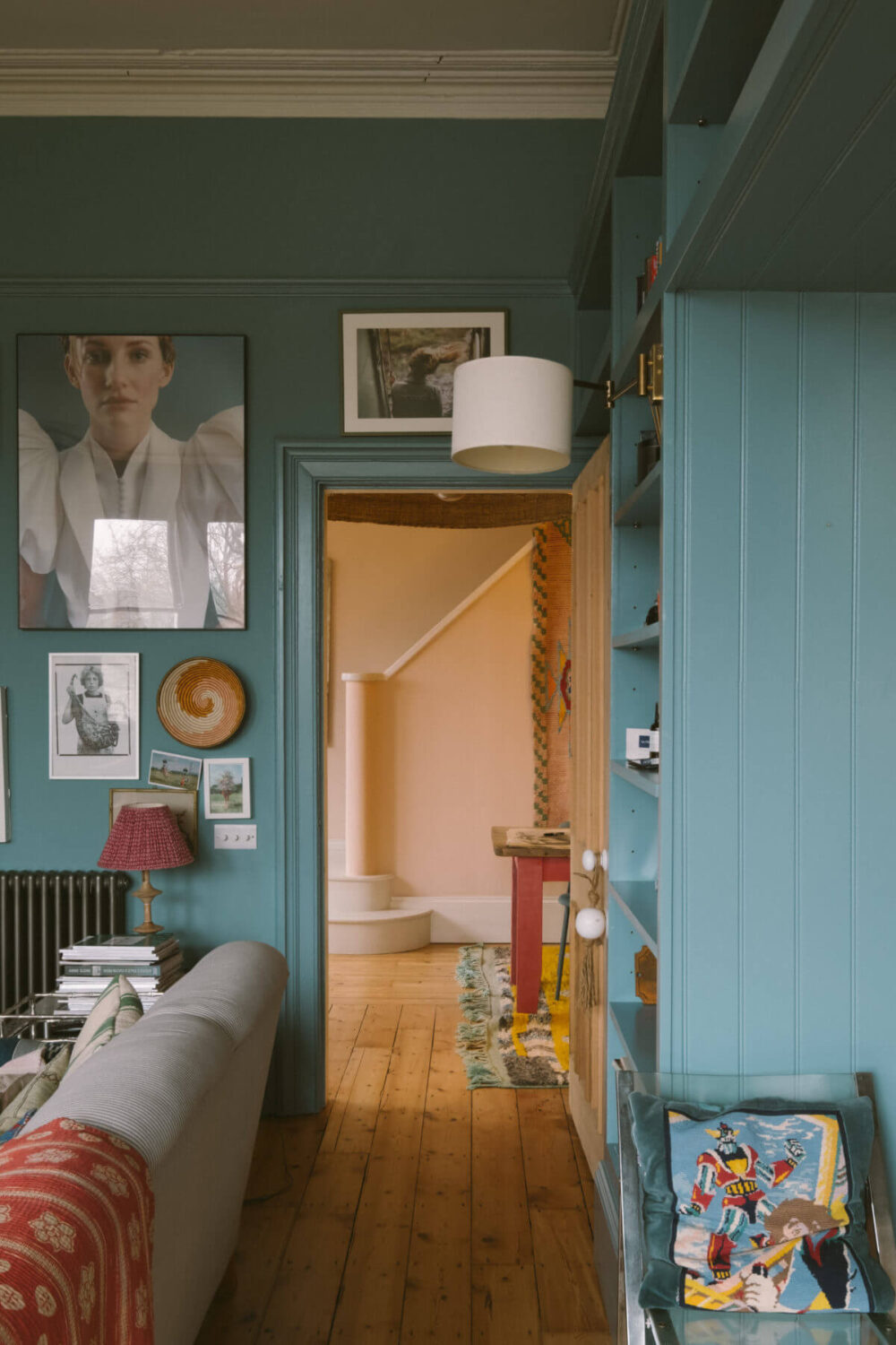 A Colorful Vintage Eclectic Home in England 7 living-room-blue-walls-wooden-floorboards-nordroom