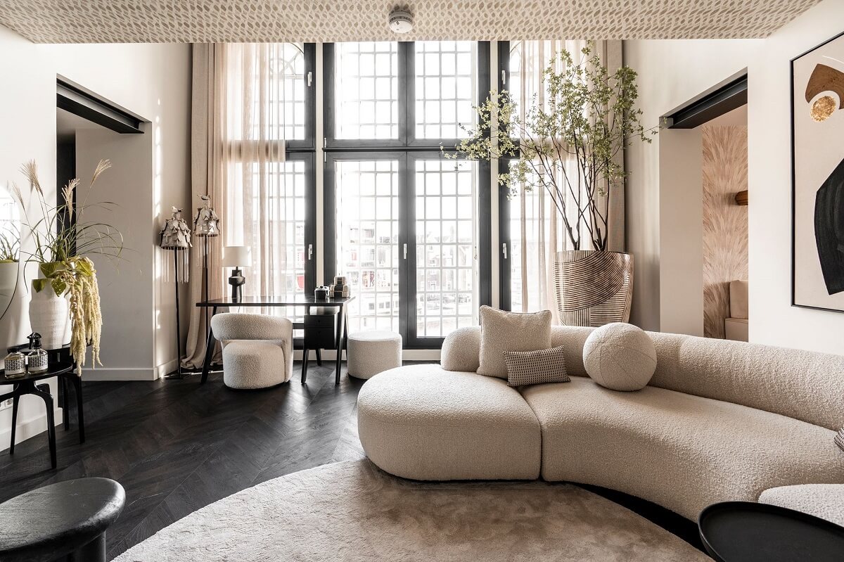 A Stylish Monochrome Penthouse in a Former Prison Building 5 living-space-curved-sofa-black-chevron-floor-nordroom