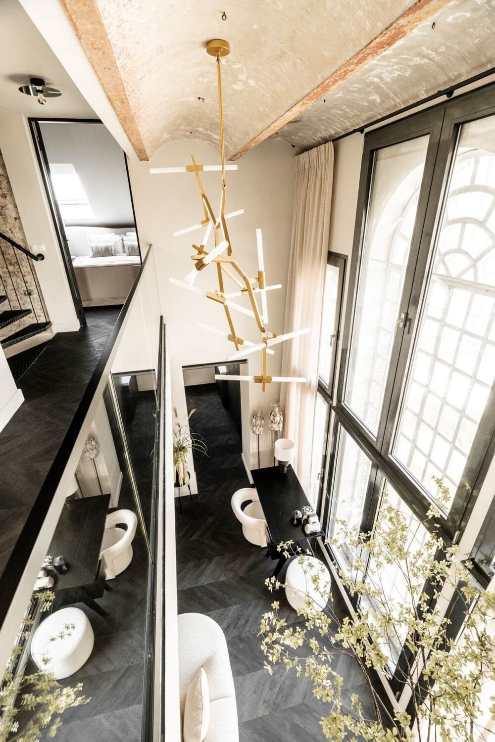 A Stylish Monochrome Penthouse in a Former Prison Building 16 loft-living-space-high-ceilings-windows-black-floor-nordroom