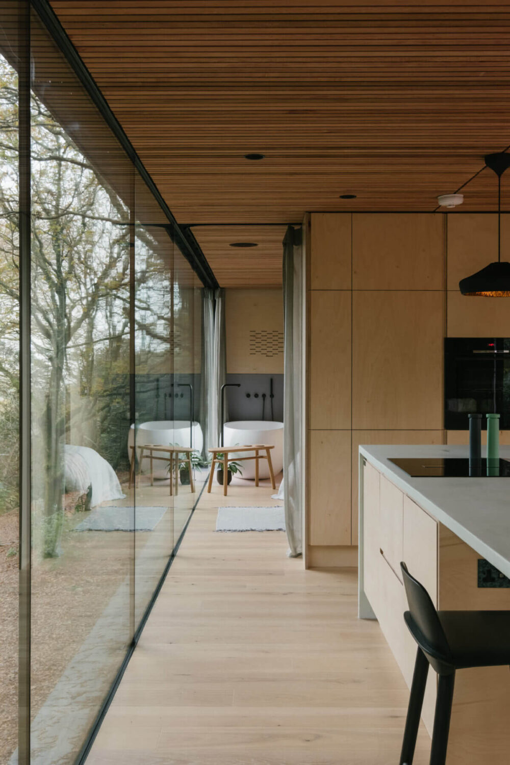A Modern Woodland Lodge with A Scandi Interior 8 loft-style-modern-wood-lodge-floor-to-ceiling-windows-nordroom