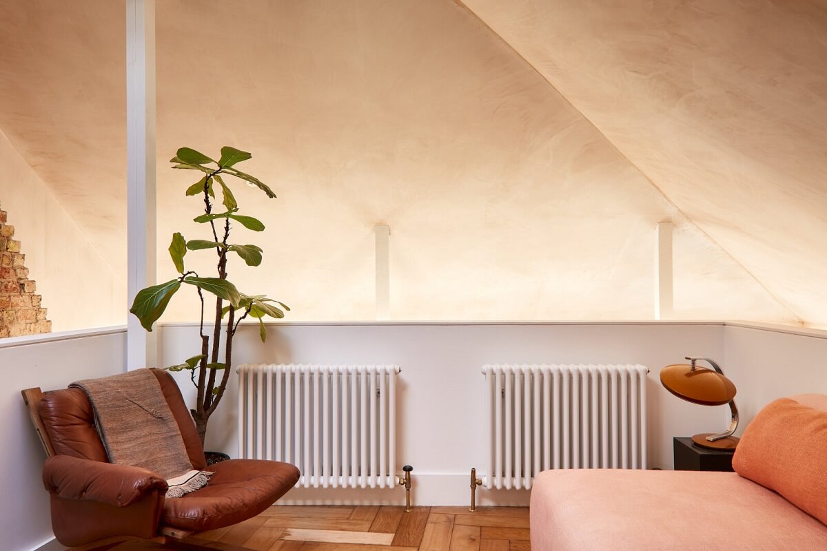 A London Home with Plaster Pink Walls and Brick Chimneys 9 mezzanine-sitting-room-plaster-pink-walls-slanted-ceiling-nordroom