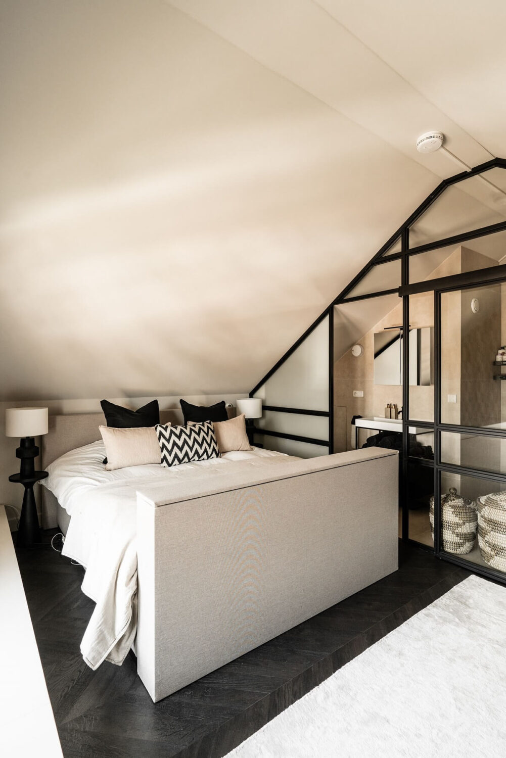 Herringbone vs. Chevron Flooring Patterns: Differences & Inspiration 35 monochrome-attic-bedroom-slanted-ceiling-glass-wall-nordroom