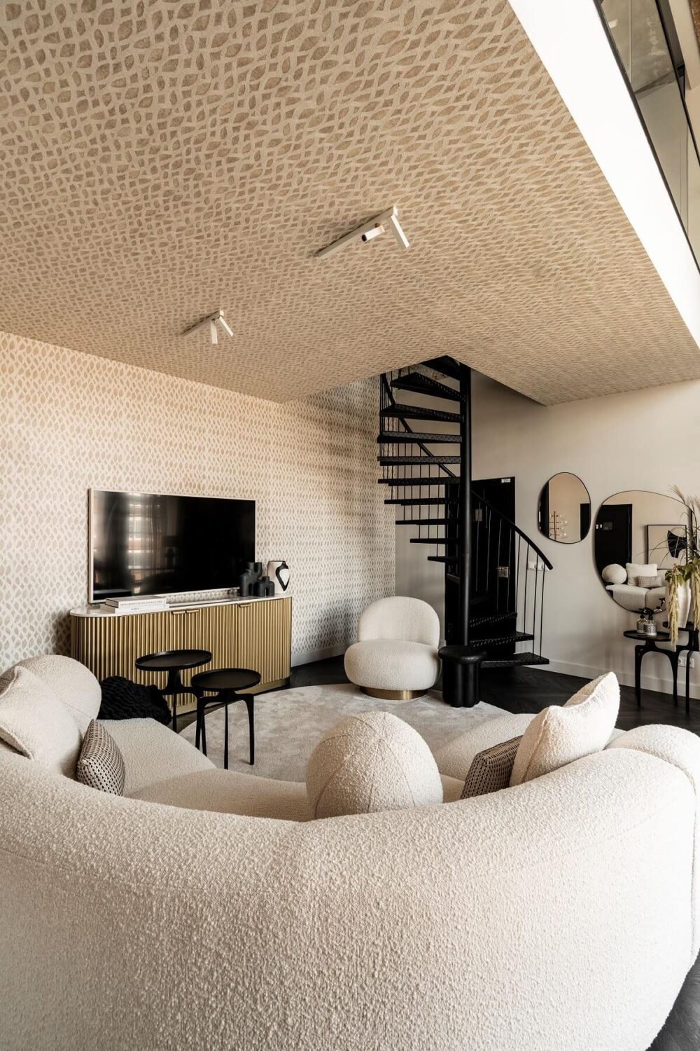 A Stylish Monochrome Penthouse in a Former Prison Building 4 monochrome-living-room-curved-sofa-spiral-staircase-nordroom