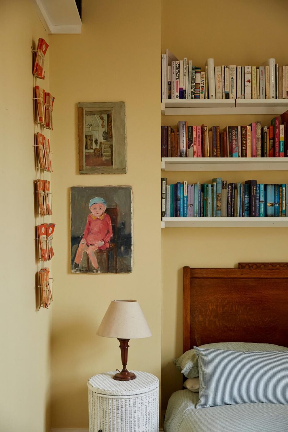 Pastel Colors in a Vintage London Home 11 pastel-yellow-walls-bedroom-bookshelves-nordroom