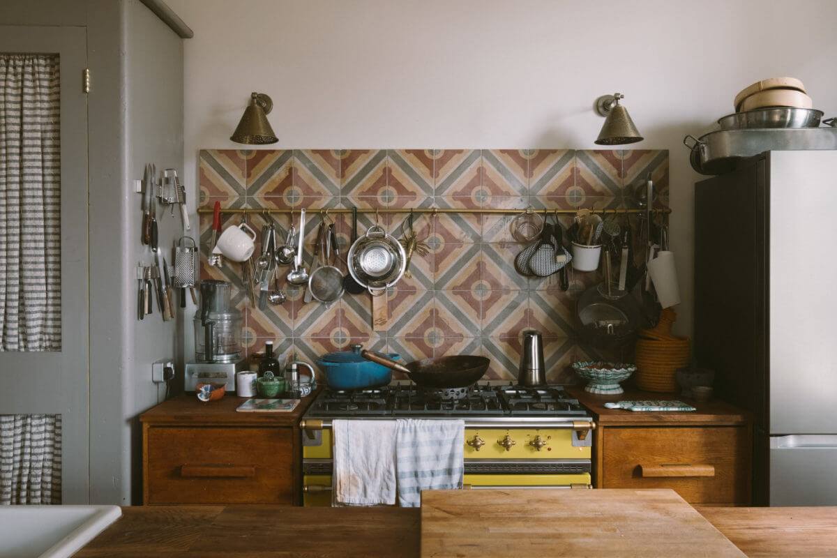 A Colorful Vintage Eclectic Home in England 11 reclaimed-kitchen-cabinets-colorful-backsplash-nordroom