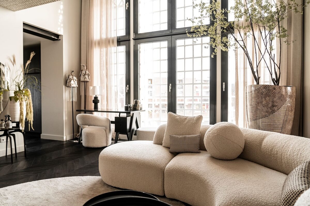 A Stylish Monochrome Penthouse in a Former Prison Building 3 round-sofa-monochrome-living-room-nordroom