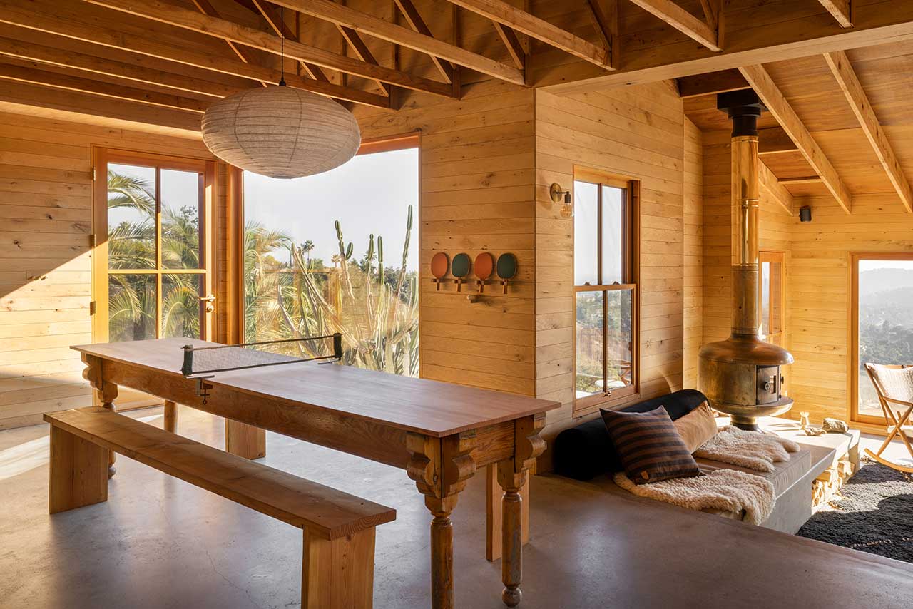 The Warm Mountaintop Home of Actor Hayden Christensen 3 rustic-dining-table-sunken-living-room-mountaintop-home-hayden-christensen-nordroom
