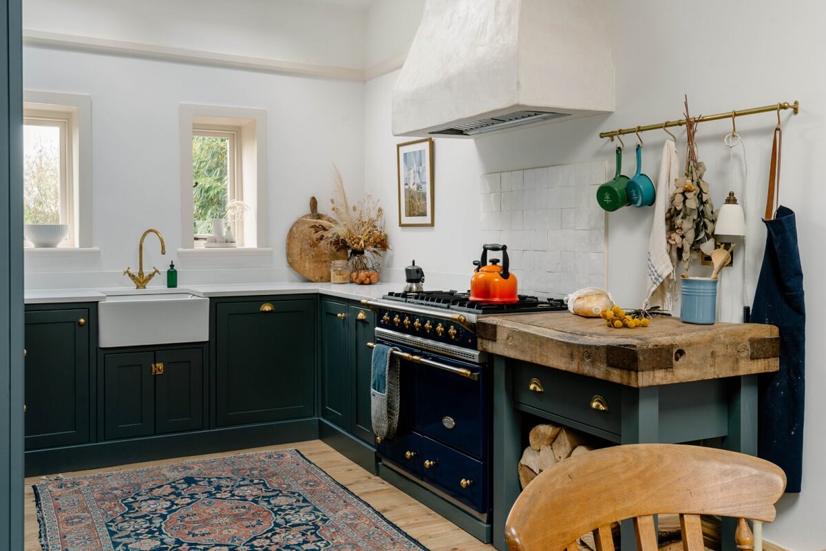 An English Barn Conversion Decorated in Green and Blue 7 rustic-kitchen-dark-blue-cabinets-butcher-block-nordroom