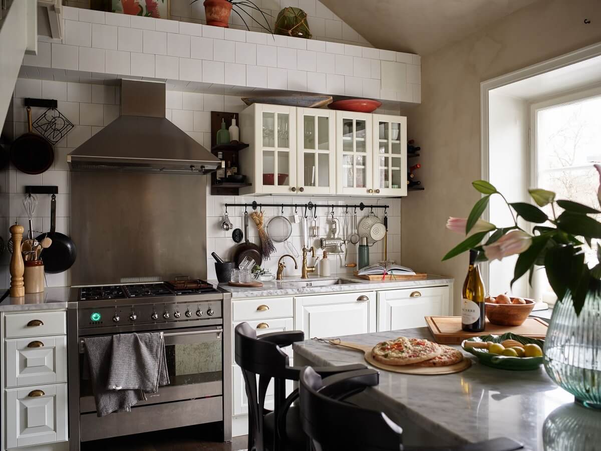 A Swedish Maisonette with a Charming Kitchen 2 rustic-white-kitchen-cabinets-island-nordroom