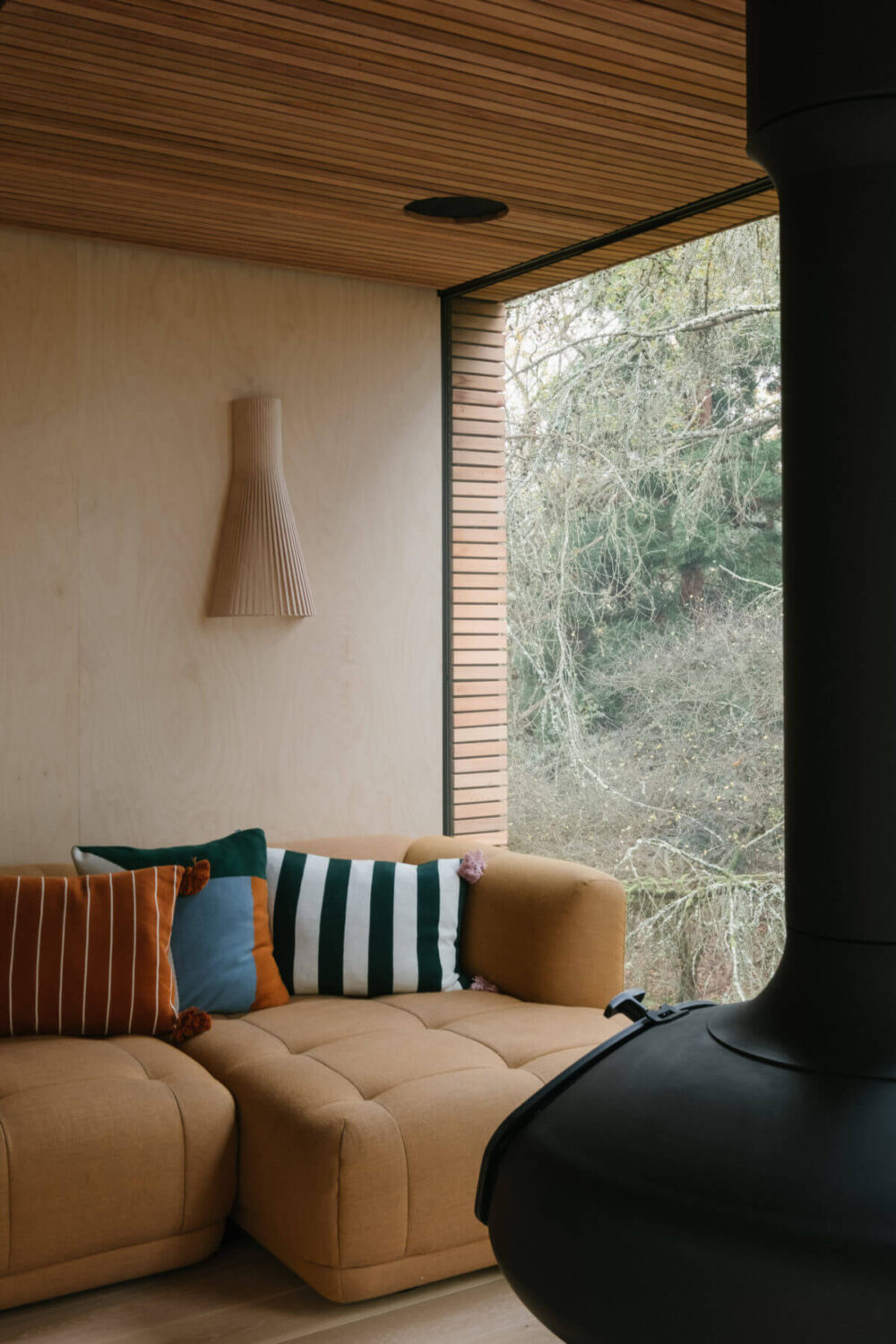 A Modern Woodland Lodge with A Scandi Interior 4 scandi-style-living-room-hay-sofa-handing-woodburner-nordroom