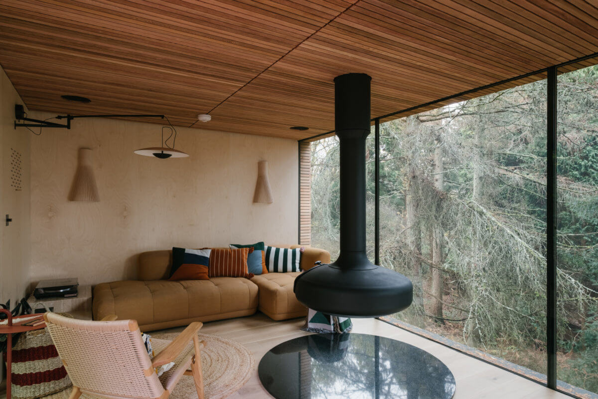 A Modern Woodland Lodge with A Scandi Interior 2 sitting-room-hanging-fireplace-modern-lodge-nordroom