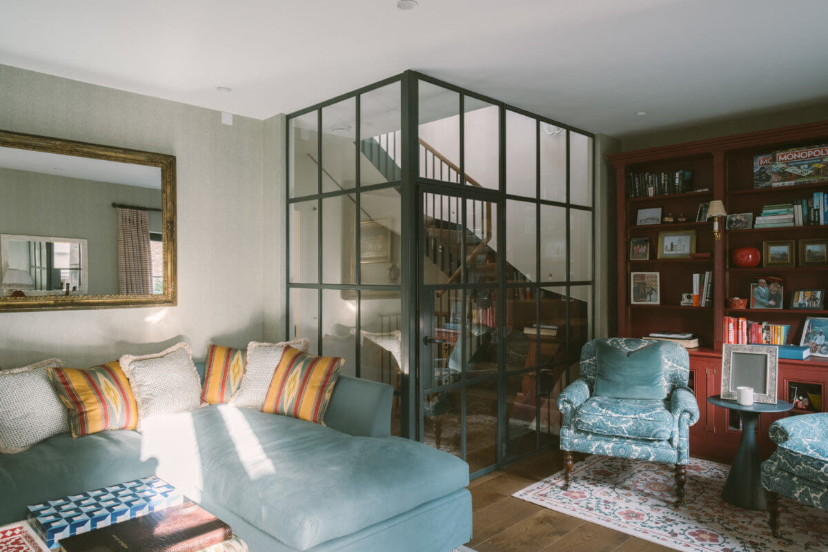 50+ Rooms That Prove ‘The Unexpected Red Theory’ Really Works 47 sitting-room-steel-framed-glass-wall-notting-hill-nordroom