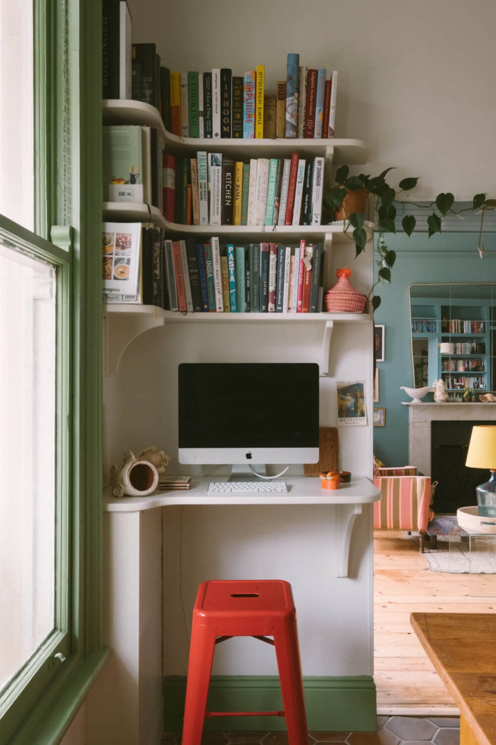 A Colorful Vintage Eclectic Home in England 16 small-home-office-shelves-red-stool-nordroom