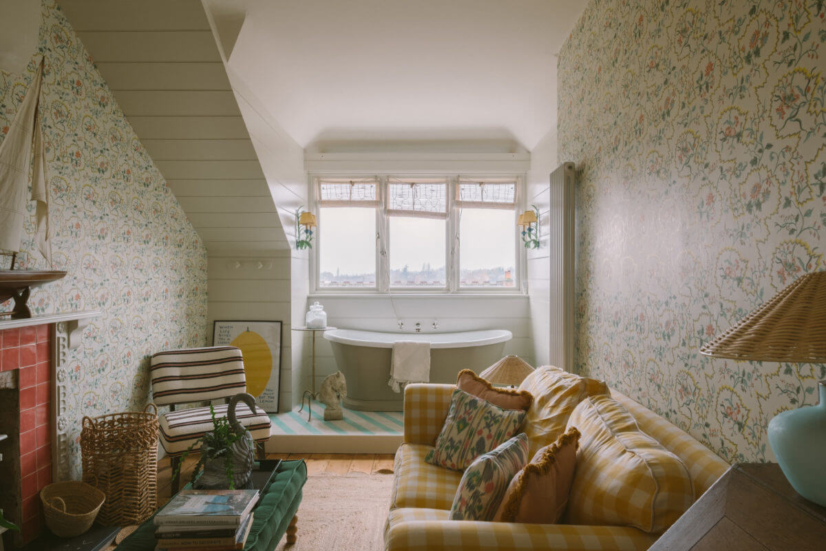 A Colorful Vintage Eclectic Home in England 24 snug-wallpaper-slanted-ceiling-freestanding-bath-nordroom