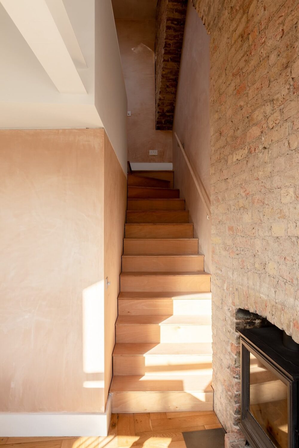 A London Home with Plaster Pink Walls and Brick Chimneys 8 staircase-mezzanine-brick-walls-nordroom