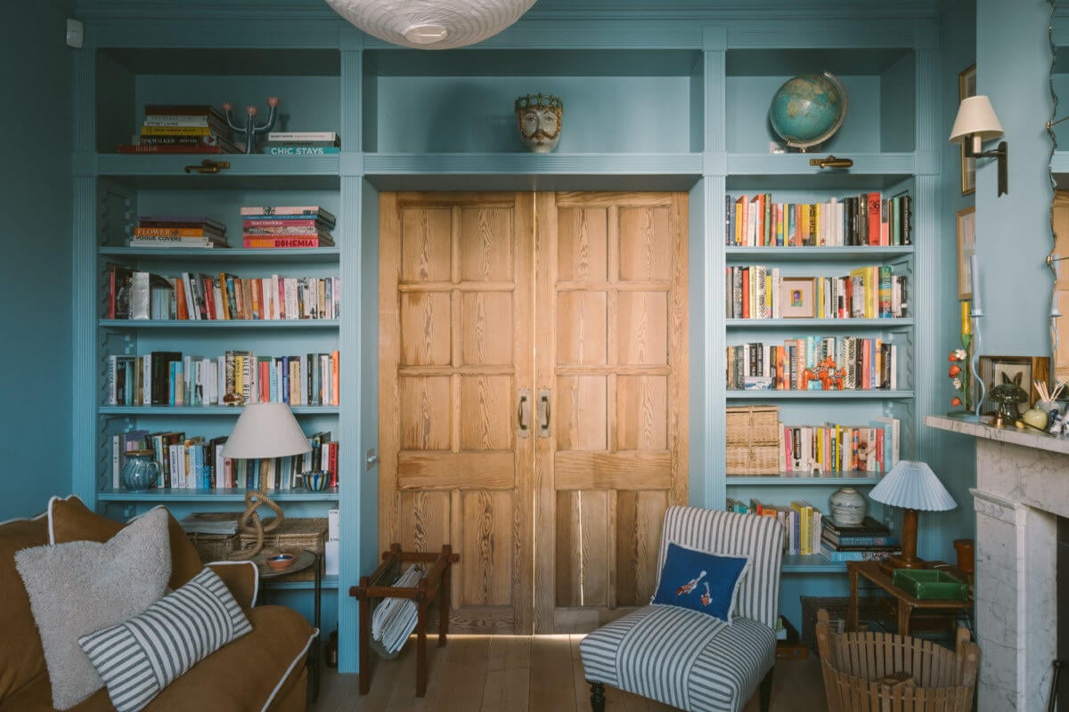 A Victorian House in London with a Blue Sitting Room 5 wood-sliding-doors-bookshelves-blue-sitting-room-nordroo