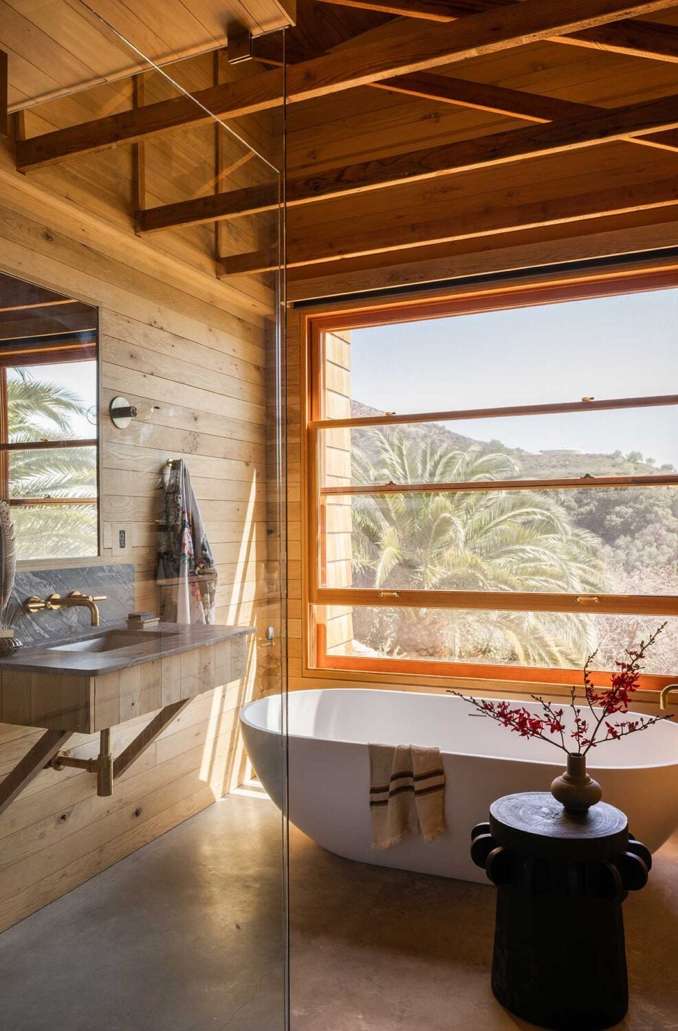 Best of 2022: Bathrooms 17 wooden-bathroom-pitched-roof-exposed-beams-freestanding-bath-nordroom