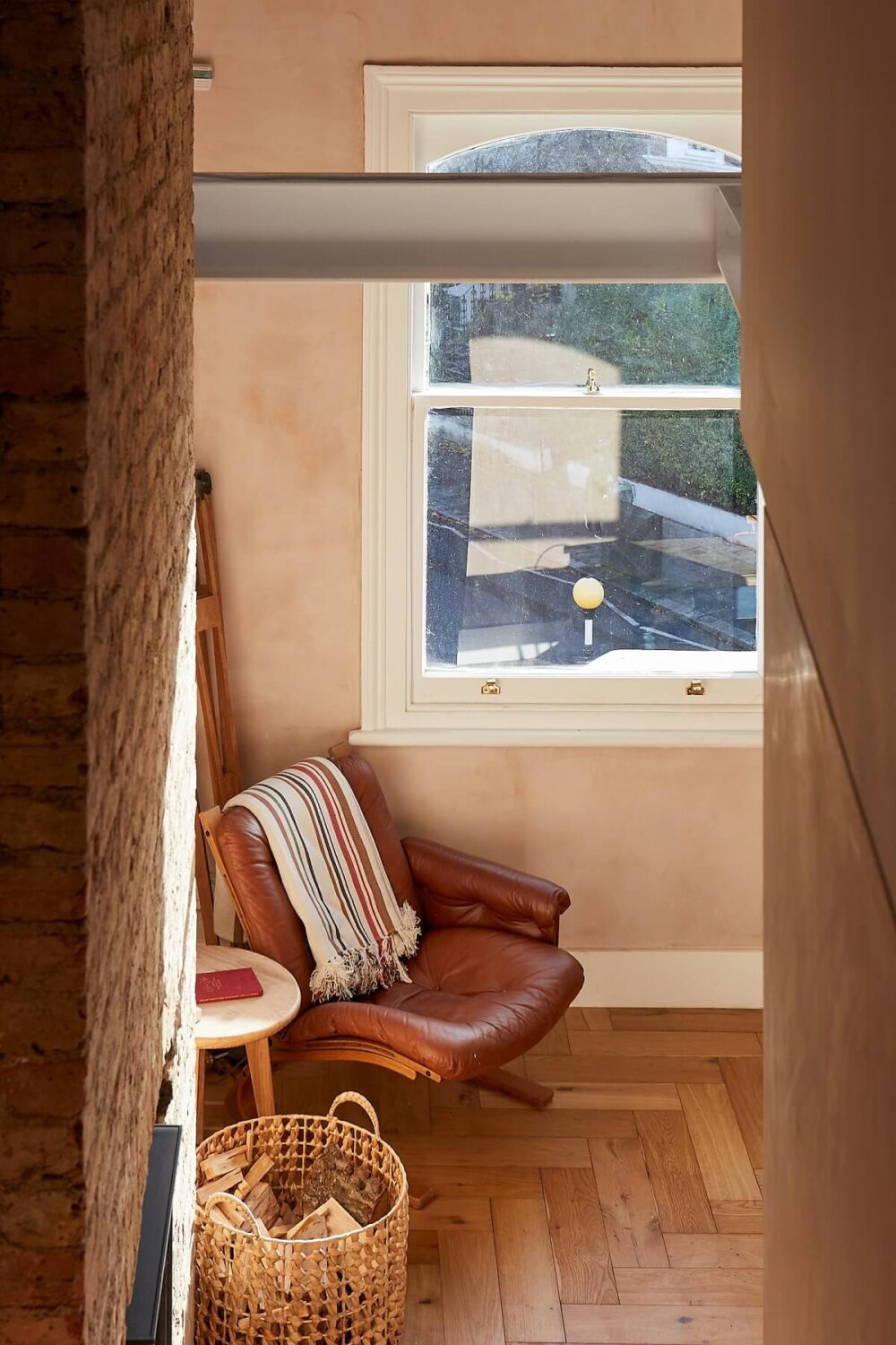 A London Home with Plaster Pink Walls and Brick Chimneys 7 wooden-herringbone-floor-reading-nook-nordroom