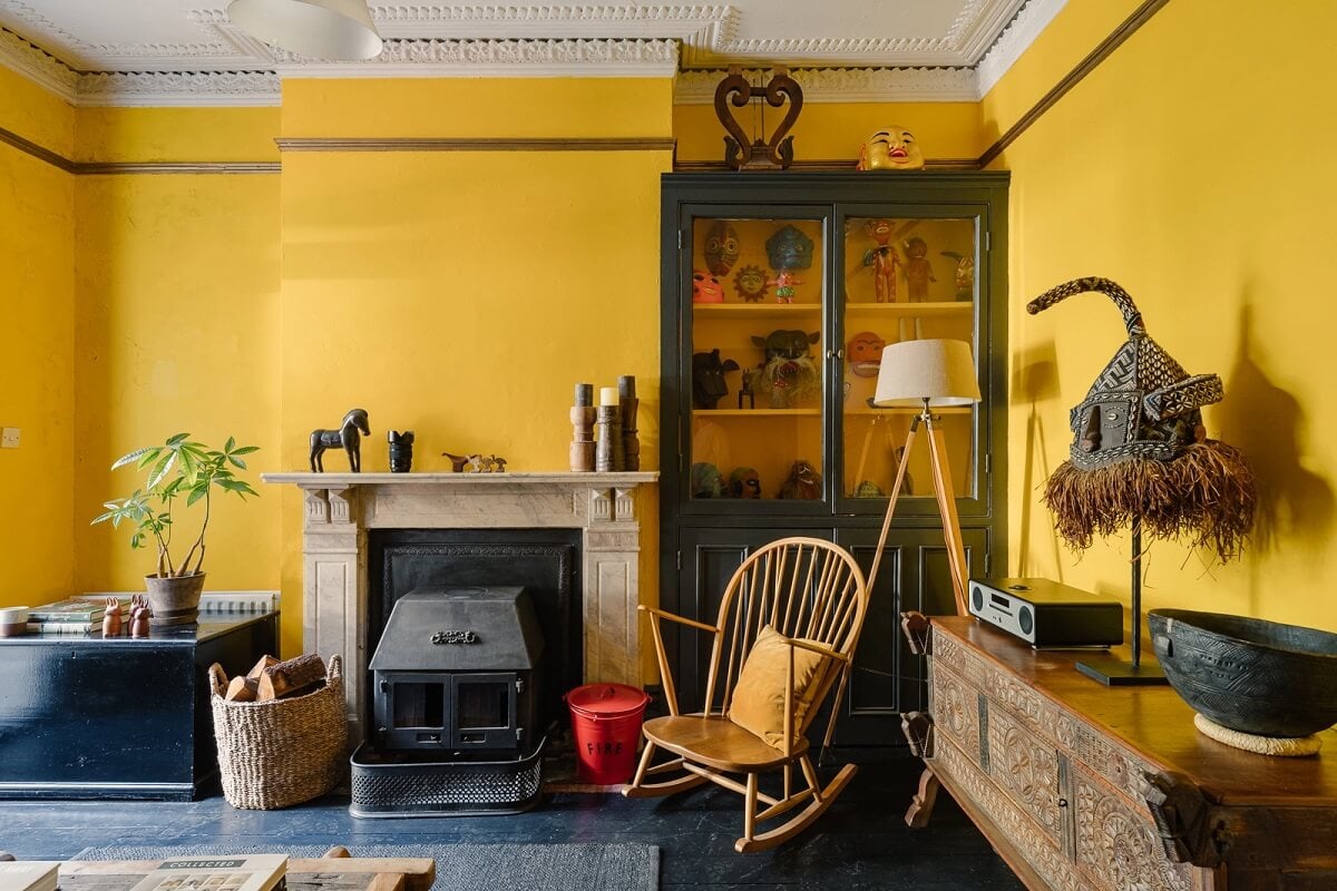 A Victorian House in London with Yellow Color Accents 10 yellow-walls-sitting-room-fireplace-rocking-chair-dark-floor-nordroom