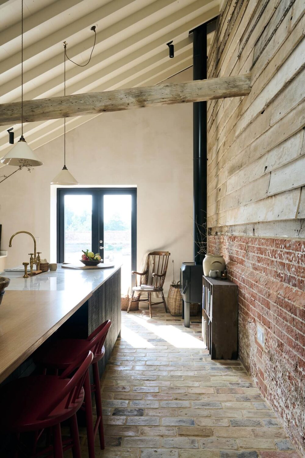 A deVOL Sebastian Cox Kitchen in a 17th Century Barn House 9 Barn-House-The-Sebastian-Cox-Kitchen-deVOL-brick-wall-woodburner-slanted-wooden-ceiling-nordroom