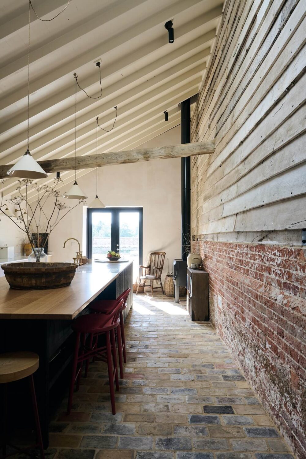 Best of 2023: Kitchens 33 Kitchen-island-The-Sebastian-Cox-Kitchen-deVOL-bar-stone-floor-brick-wall-sloped-ceiling-nordroom