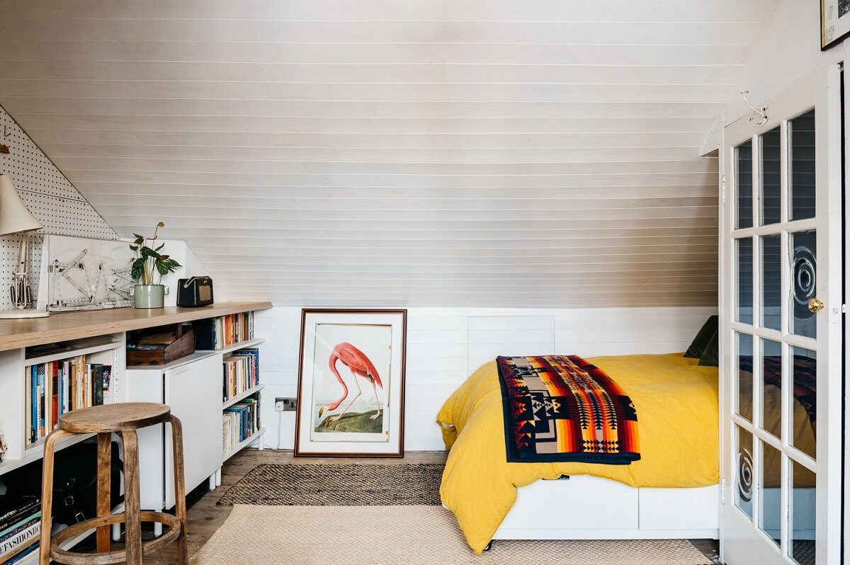 Colorful Rooms in a Historic English Home 18 attic-bedroom-craft-room-yellow-bedding-nordroom