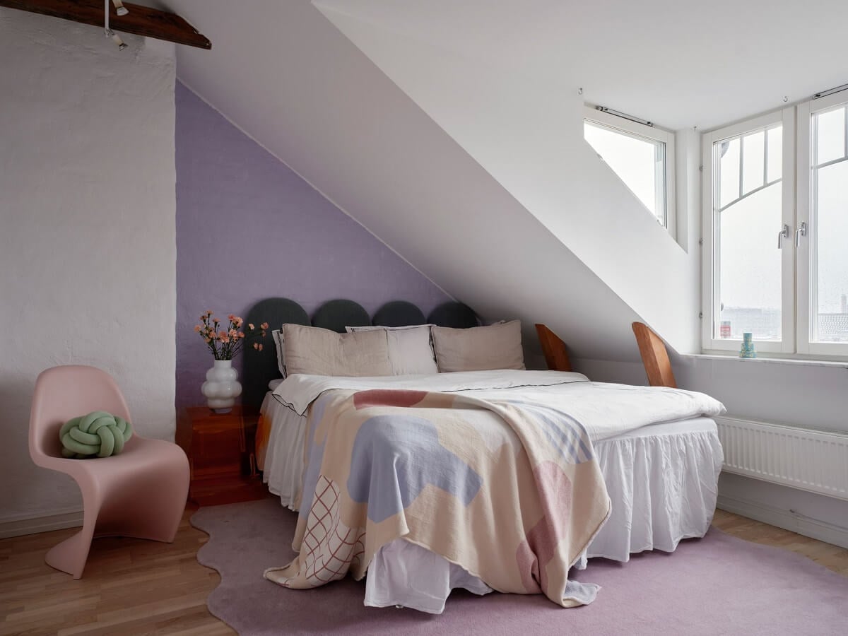 Pastel Color Accents in a Scandinavian Penthouse Apartment 15 attic-bedroom-lavender-pastel-accent-wall-nordroom