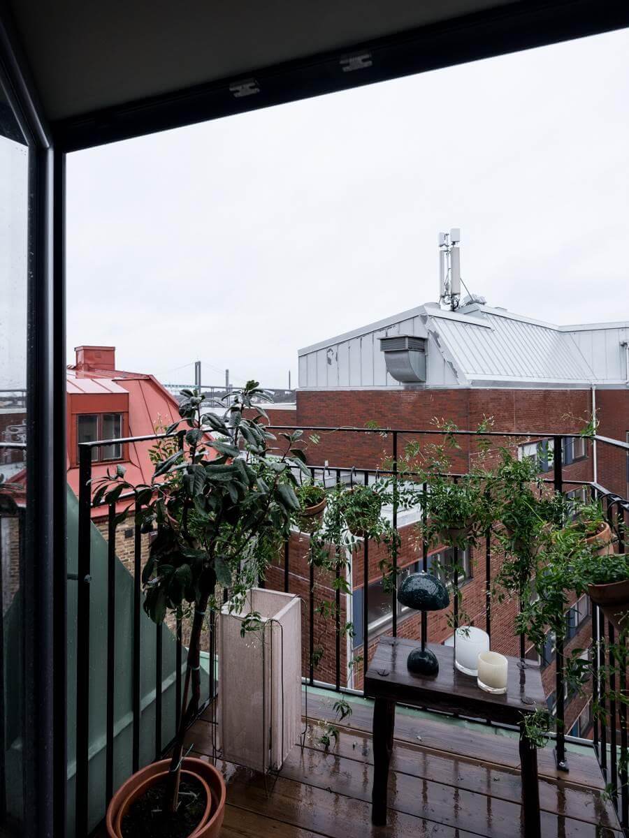 A Small Scandinavian Loft with Skylights and Brick Wall 13 balcony-small-scandinavian-loft-apartment-nordroom