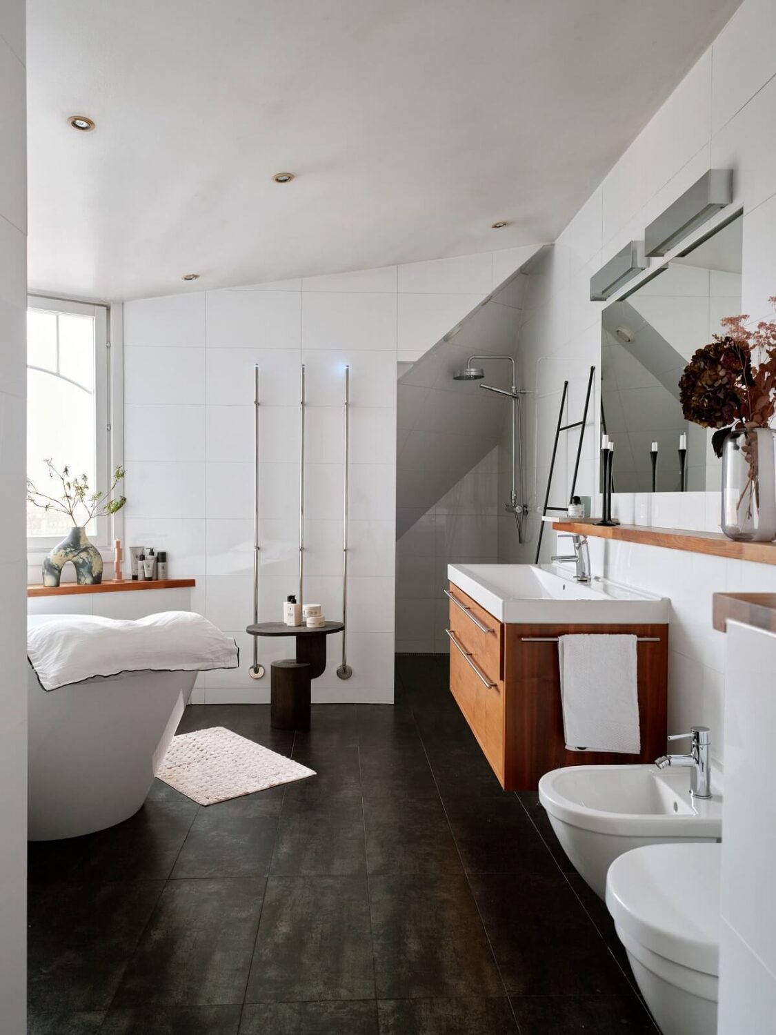 Pastel Color Accents in a Scandinavian Penthouse Apartment 17 bathroom-dark-floor-freestanding-bath-nordroom