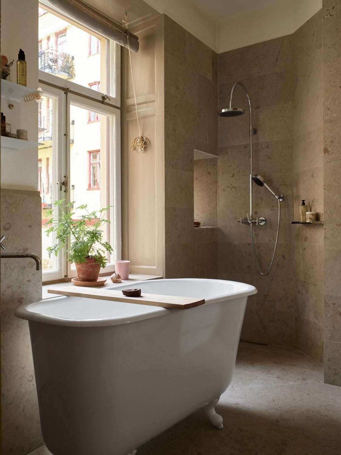 A Beige Vintage Apartment in Stockholm 22 bathroom-freestanding-bath-walk-in-shower-nordroom