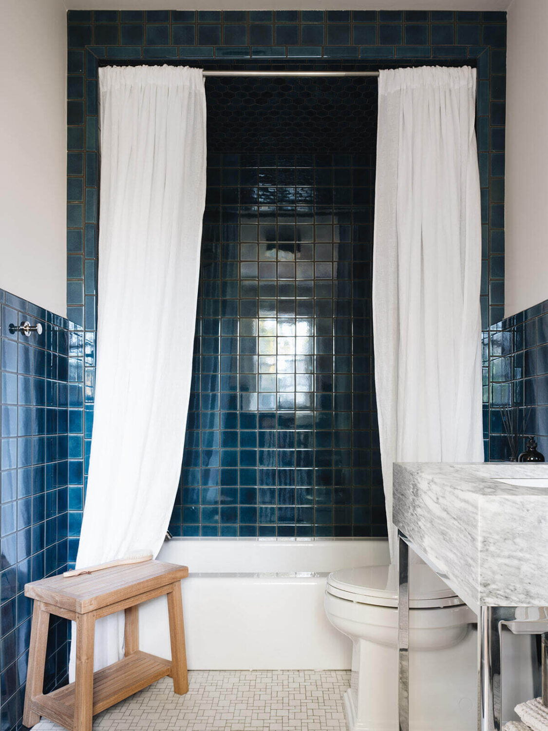 A Classic 1930s Home in Grand Rapids Designed by Jean Stoffer 37 bathroom-glossy-blue-tile-bath-shower-nordroom