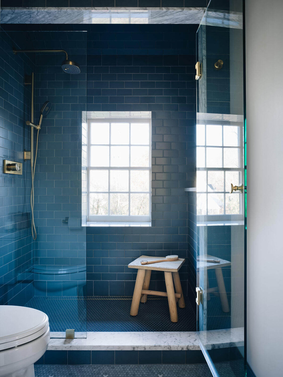 A Classic 1930s Home in Grand Rapids Designed by Jean Stoffer 34 bathroom-large-shower-window-blue-tiles-jean-stoffer-design-nordroom