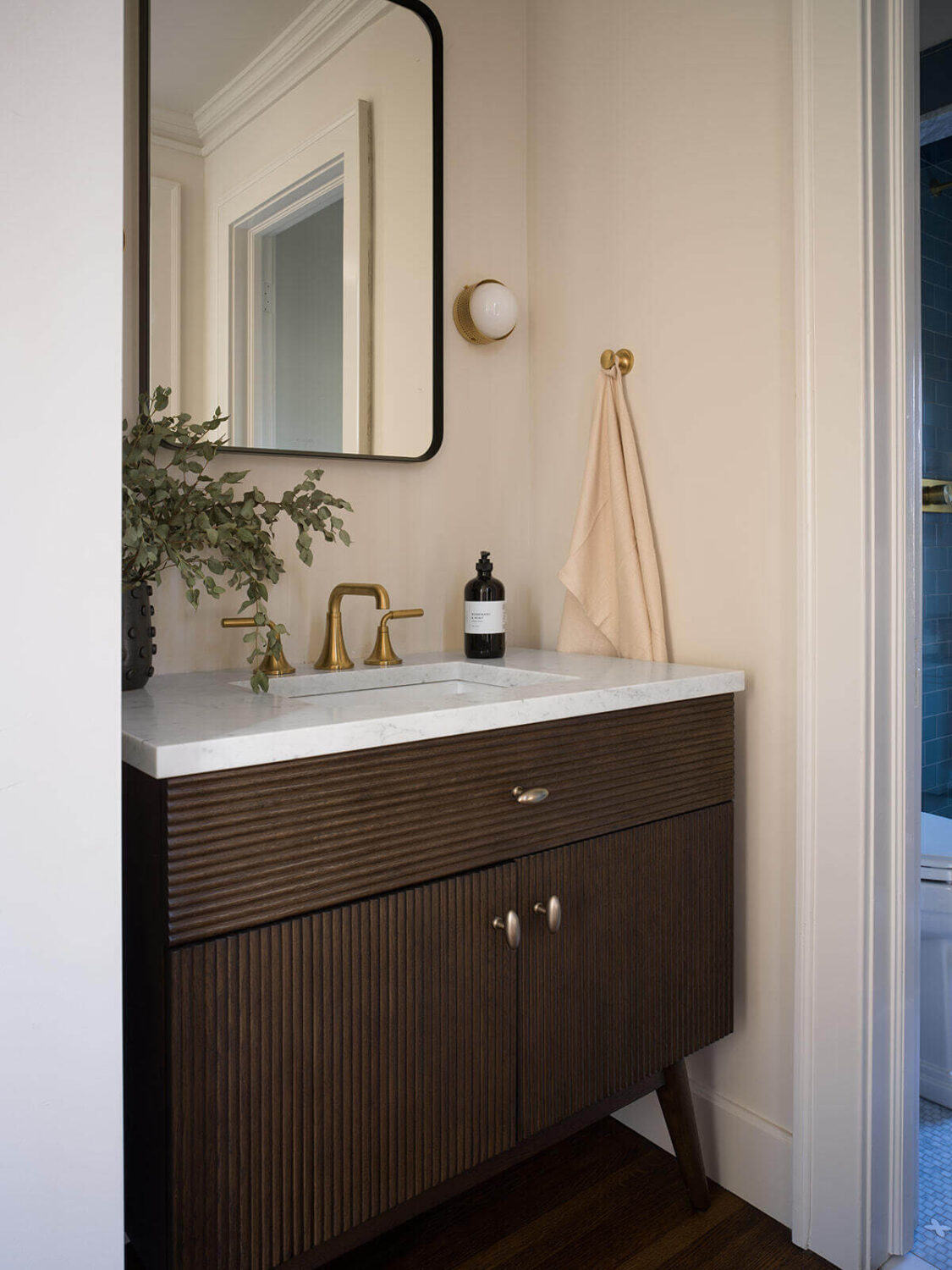 A Classic 1930s Home in Grand Rapids Designed by Jean Stoffer 35 bathroom-sink-table-dark-wood-nordroom