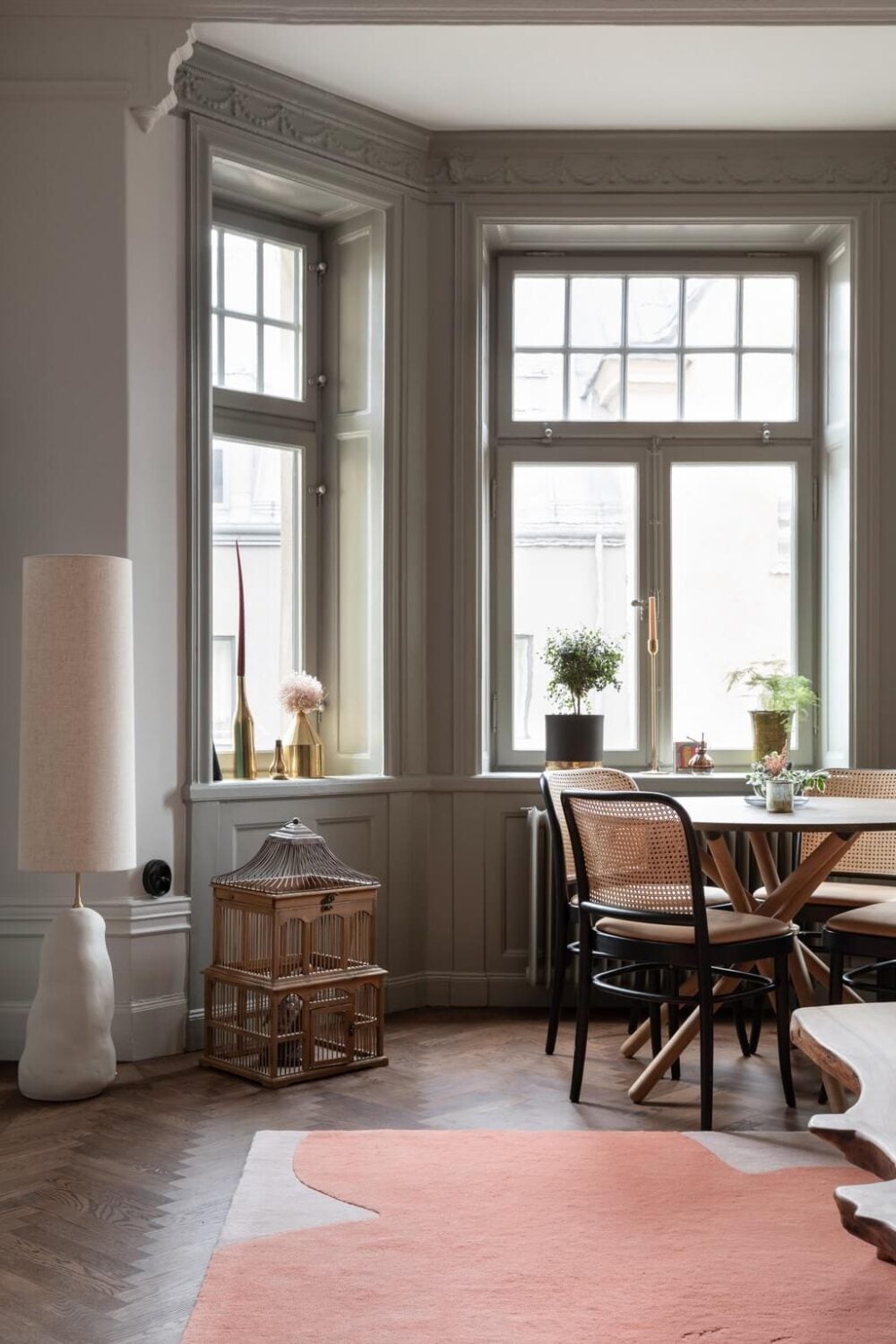 A Classic Swedish Apartment with Light Gray Walls 8 bay-window-dining-space-living-room-nordroom