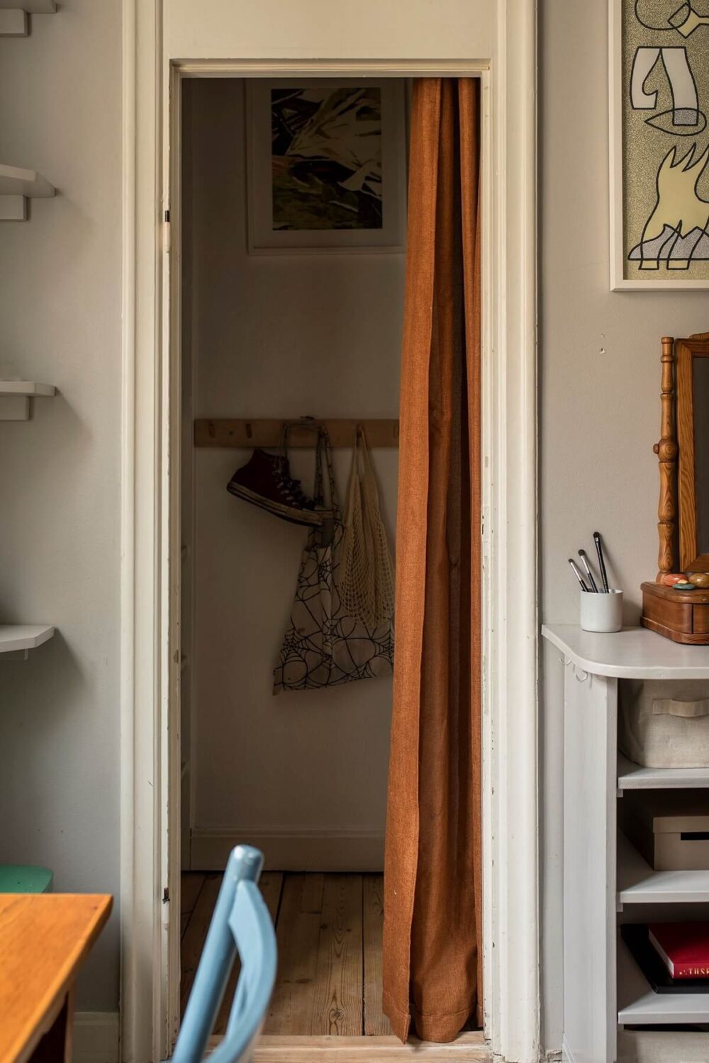 A Small Swedish Apartment Decorated in Midcentury Style 14 bedroom-closet-earthy-brown-curtain-nordroom