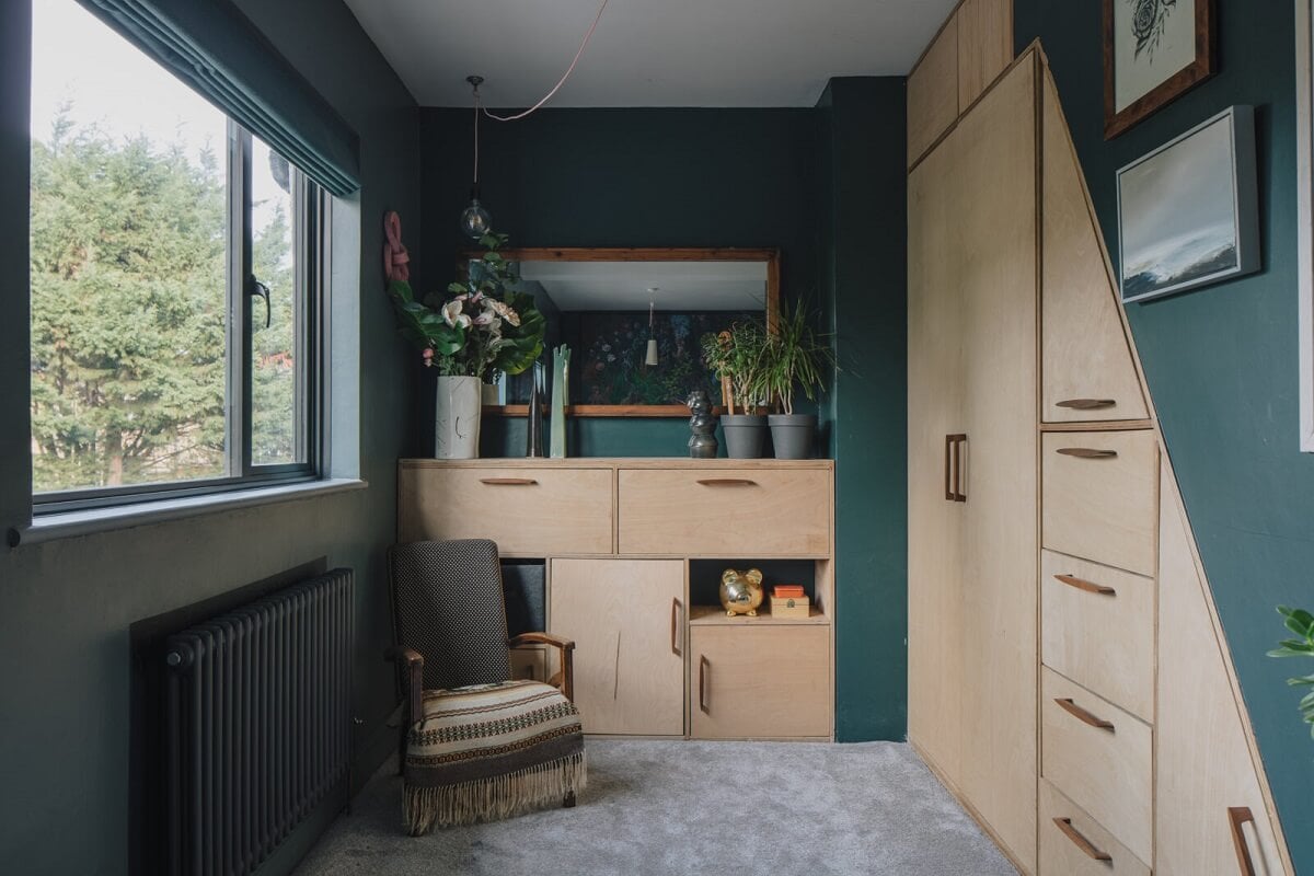 A London Home with Moody Rooms and a Pink Kitchen 13 bedroom-moody-green-walls-built-in-wardrobes-nordroom