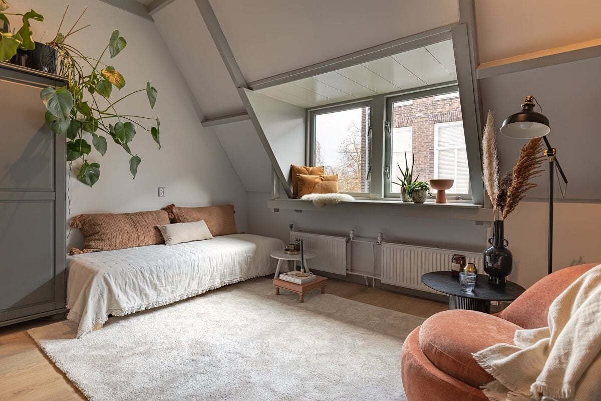 Gray and Earth Tones in a Restored Weavers House in The Netherlands 19 bedroom-slanted-ceiling-reading-corner-nordroom