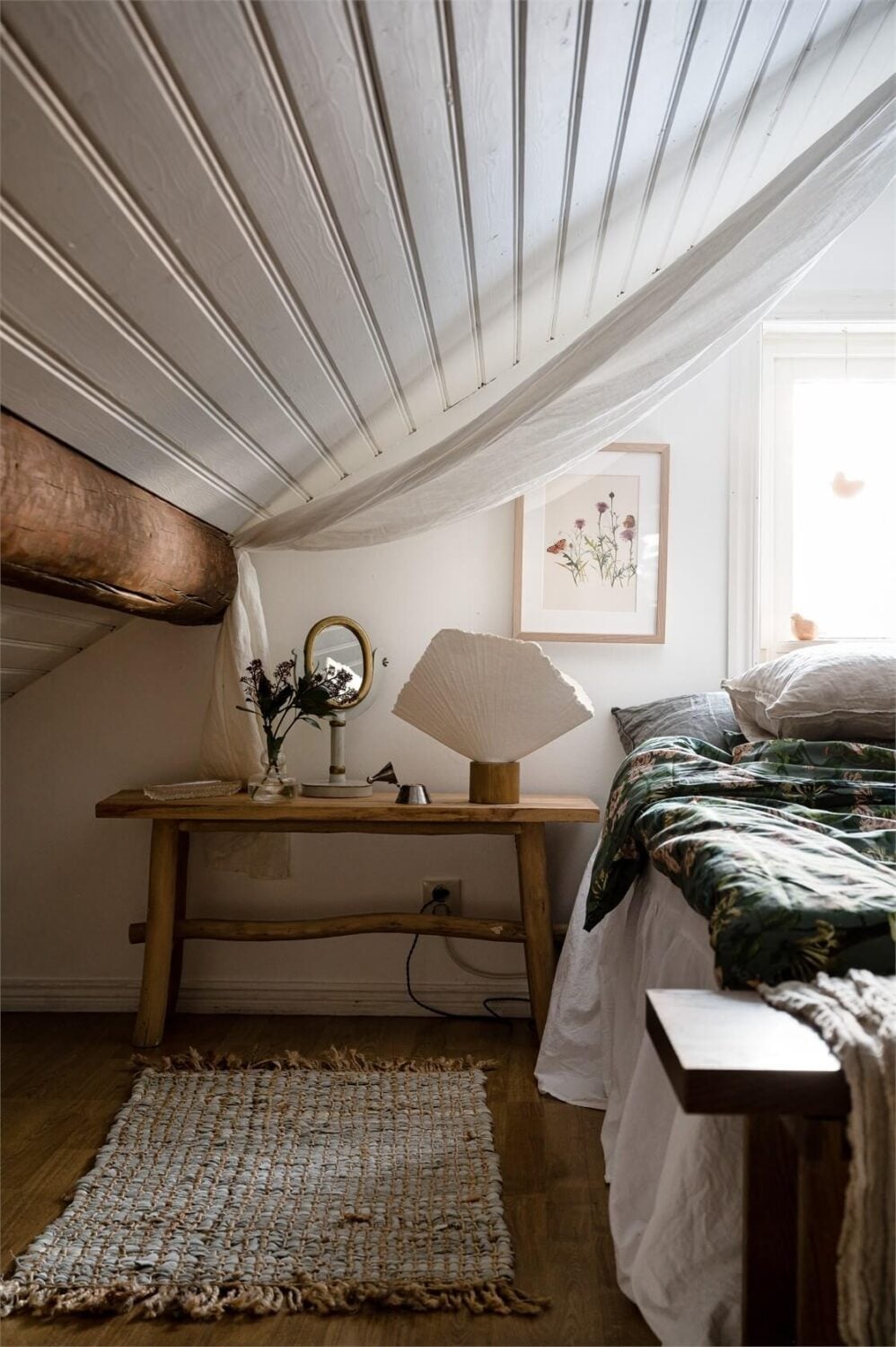 A Charming Countryside Villa in Sweden 20 bedroom-slanted-wall-exposed-beams-wooden-floor-nordorom