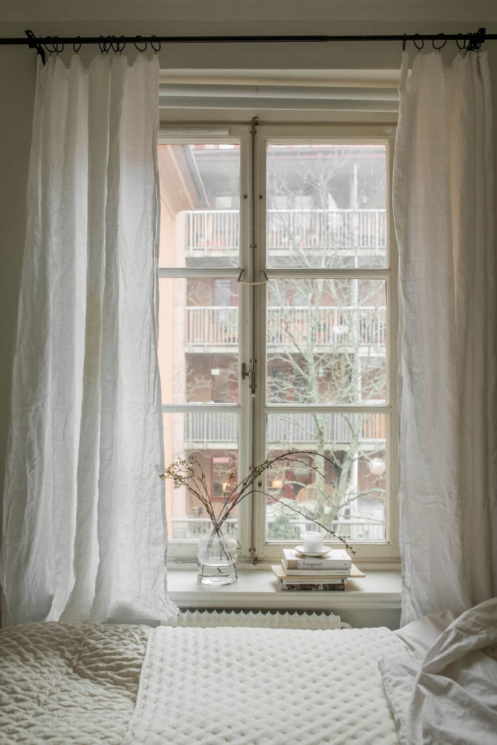 A Serene Light Colored Apartment in Stockholm 11 bedroom-window-curtains-light-colors-nordroom
