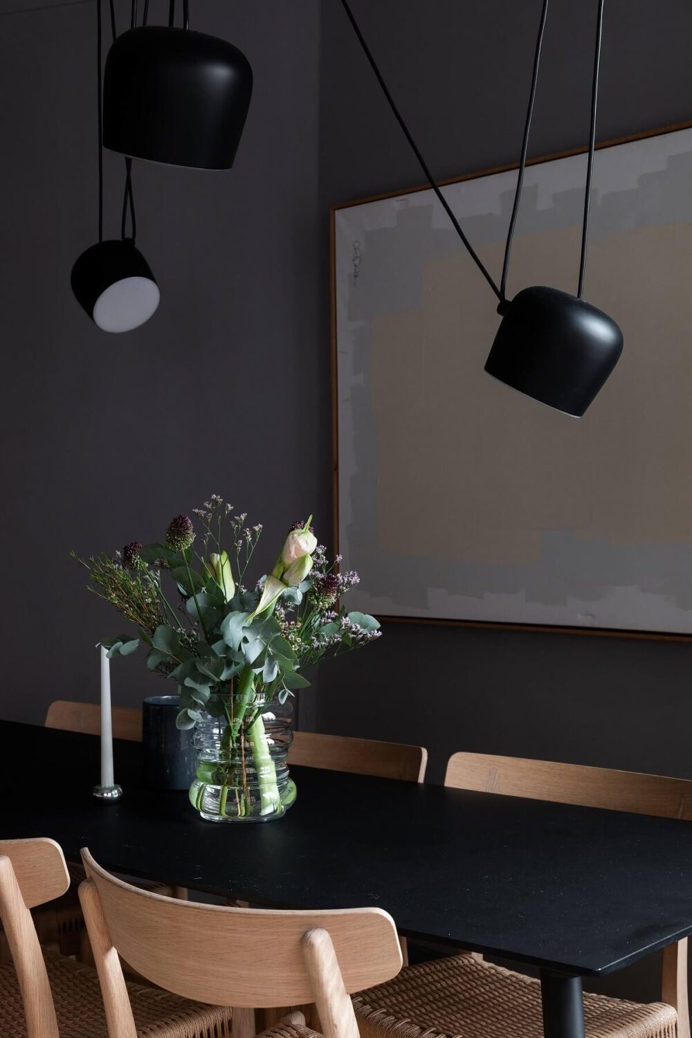 A Stylish Gray Apartment in Stockholm 6 black-dining-table-large-artwork-nordroom